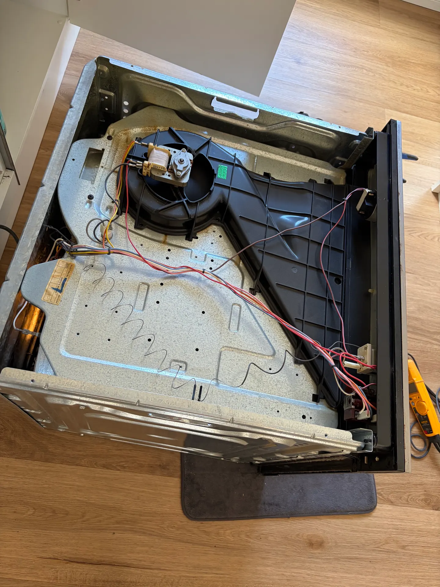 Oven internals during an appliance electrical repair