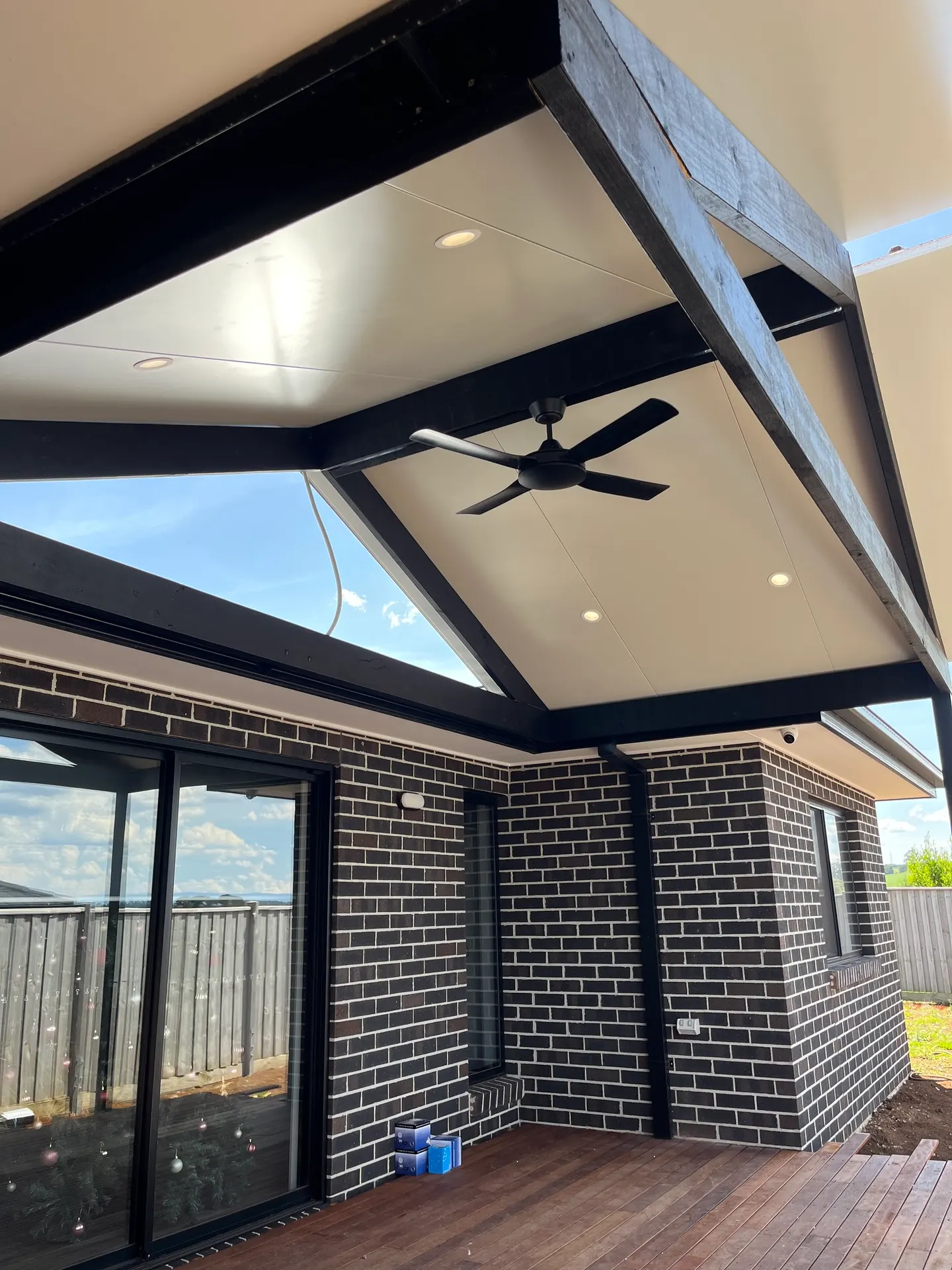 Ceiling fan mounted to an exposed timber beam