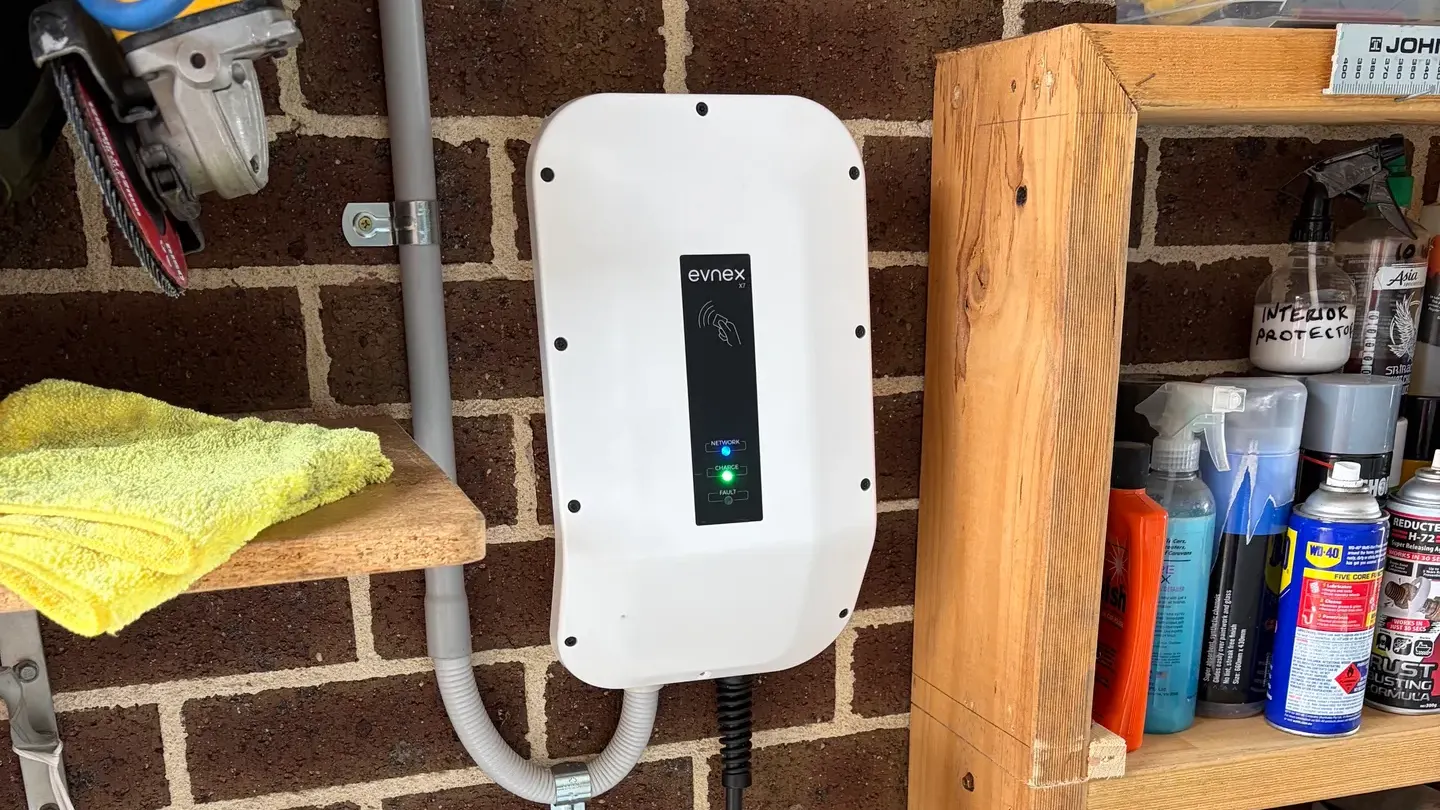 EV charger installed on a residential brick wall