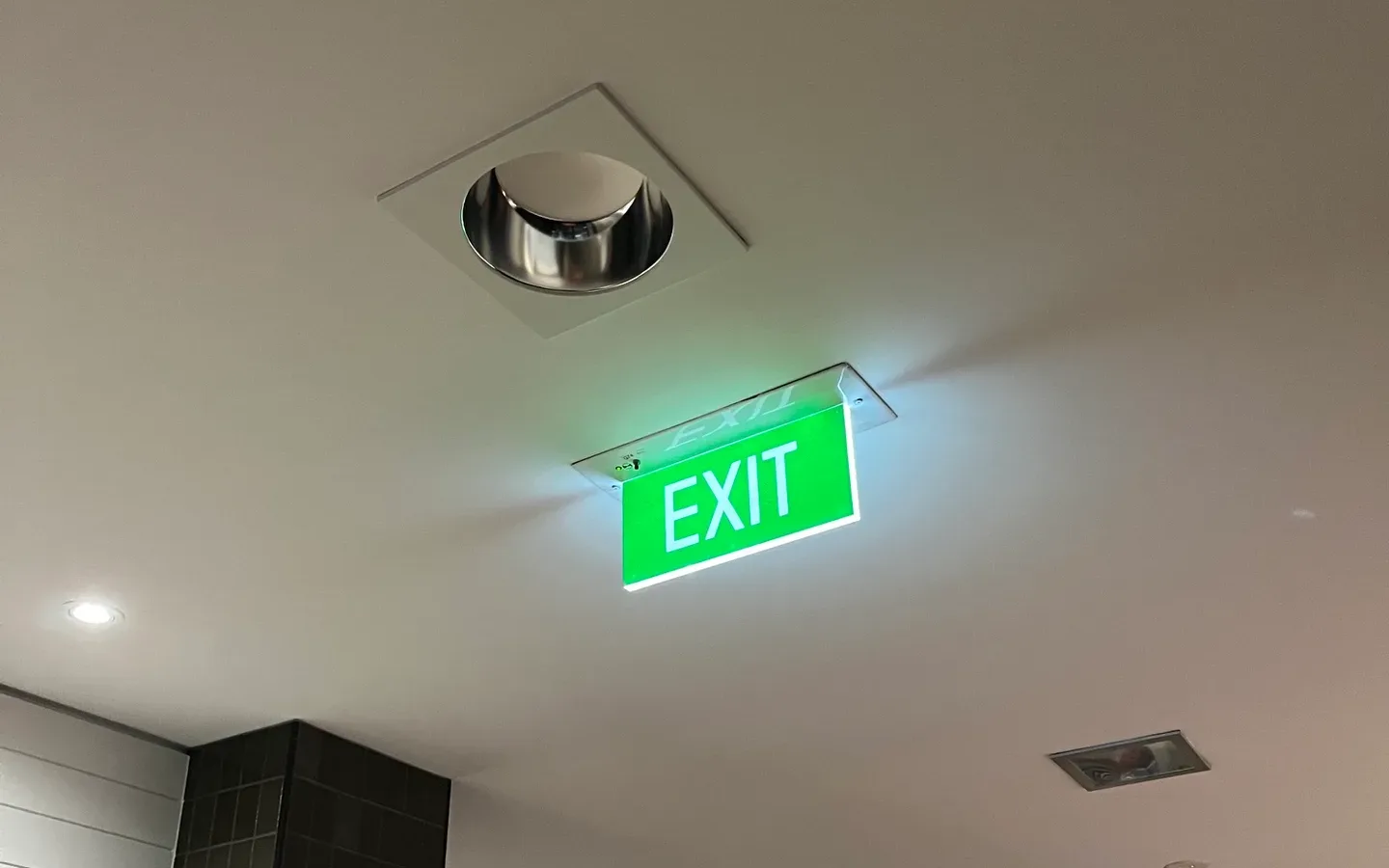 Illuminated exit sign during an emergency lighting inspection